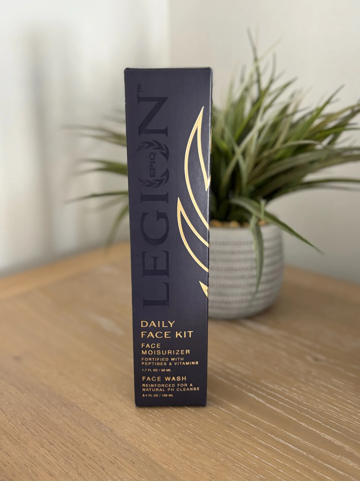 Daily Face Kit packaging on a table with a plant